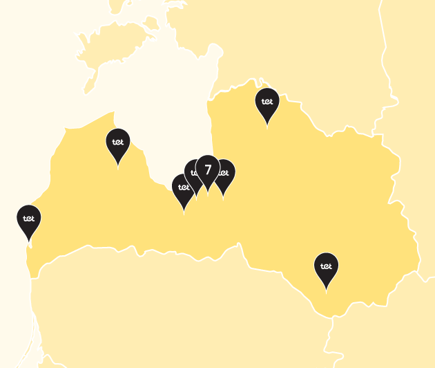 Karte ar iezīmētu Latvijas kontūru un dzeltenas krāsas punktiem, kuros iekšā rakstīts Tet (SIA Tet veikalu atrašanās vietas)