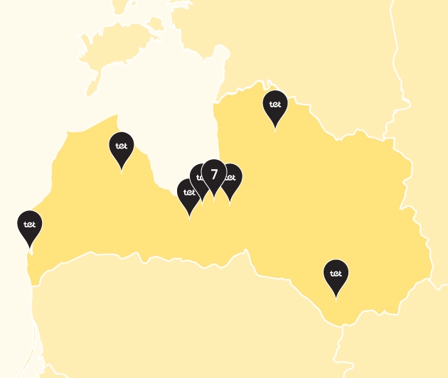 Karte ar iezīmētu Latvijas kontūru un dzeltenas krāsas punktiem, kuros iekšā rakstīts Tet (SIA Tet veikalu atrašanās vietas)