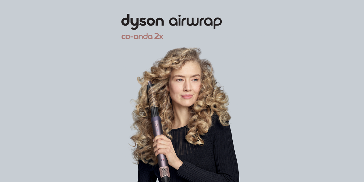 Sieviete ar cirtainiem matiem lieto Dyson